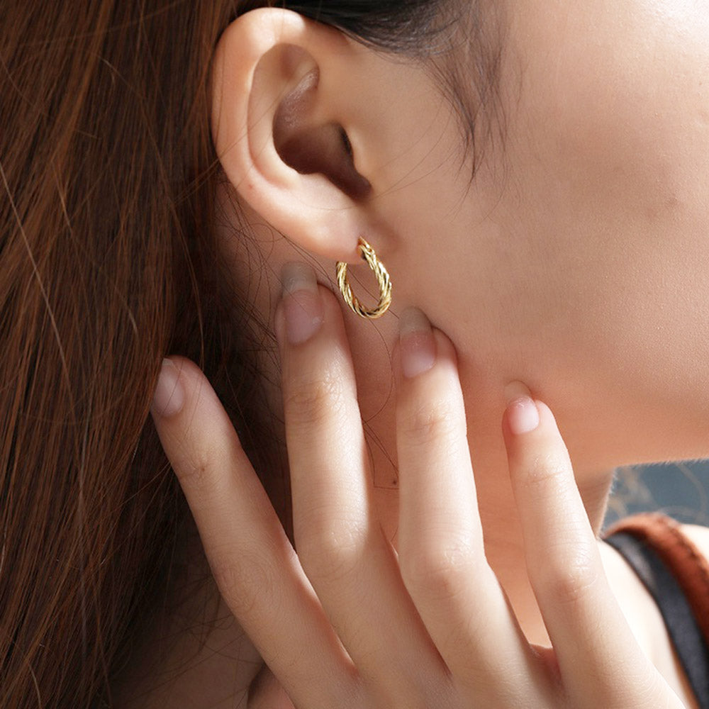 Gold twisted hoop earrings